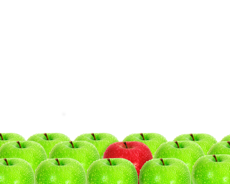 red apple place on white background among green apple with water droplet as frame border  unique の写真素材