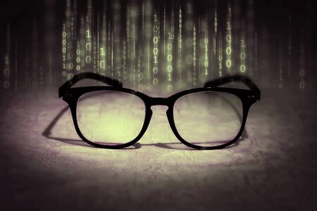 the reading eyeglasses absorb binary data , concept of future knowledge technology visionの写真素材