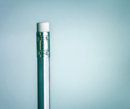 close up eraser on top silver pencil on the  blue gray gradient backgroundの写真素材
