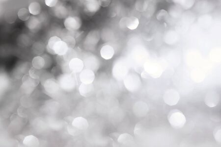 The Abstract bokeh lighting background , silver color toneの写真素材