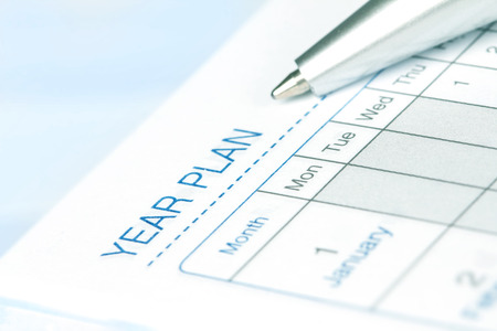 selective focus on   the year plan page of opened lined diary bookの写真素材