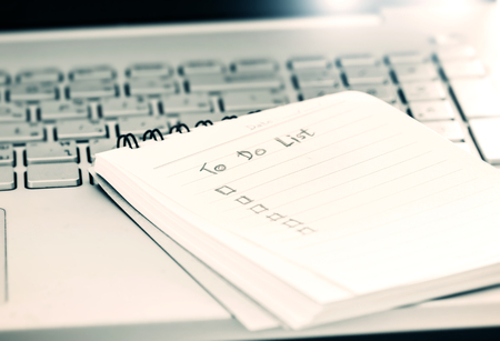 close up Handwritten to do list plan in a  small note bookの写真素材