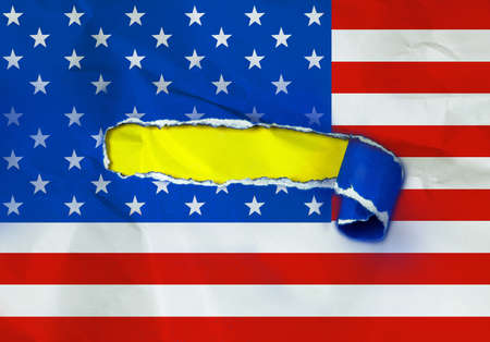 The American flag on Torn Paper and space with yellow paper background , Independence day conceptの写真素材