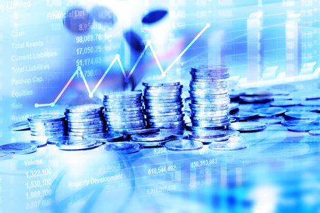 the Coins stacked with falling moving for business financial and stock investment background