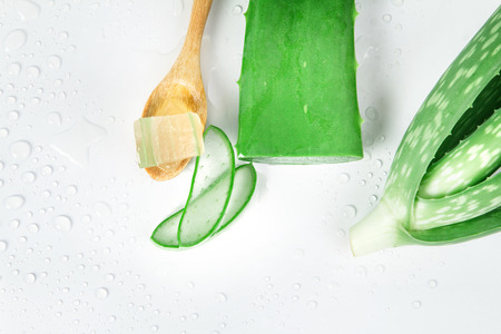 sliced and leaf of fresh aloe vera on white background , natural clear gel as the star beauty ingredient  for skin careの写真素材