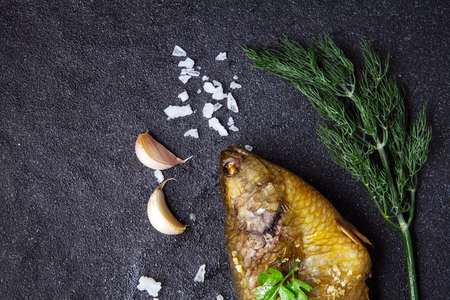 Delicious grilled fresh fish on dark stone background , healthy or diet food.の写真素材