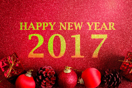 red christmas ball and gift decoration on the glitter background