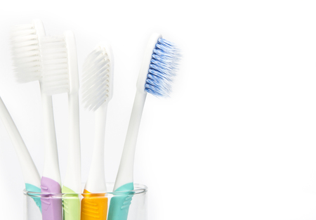 close up the  toothbrush in transparent glass on white backgroundの写真素材