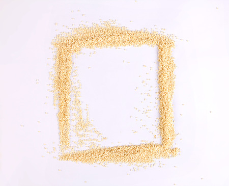 the white sesame seeds  as frame border on white backgroundの写真素材