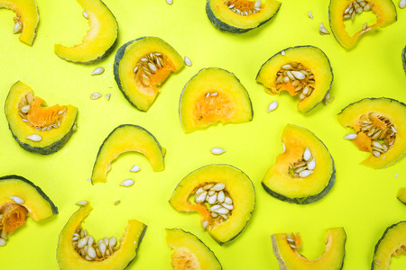 sliced fresh asian pumpkin pattern on vibrant color backgroundの写真素材