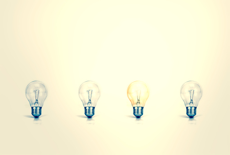 Outstanding creative idea background concept . one Light bulb glowing among a group light bulbs.vintage color toneの写真素材