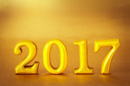 Number 2017 placed on gold elegant glamour background for new year 2017 celebration concept