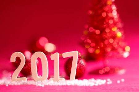 2017 new year wooden word on red glitter christmas background