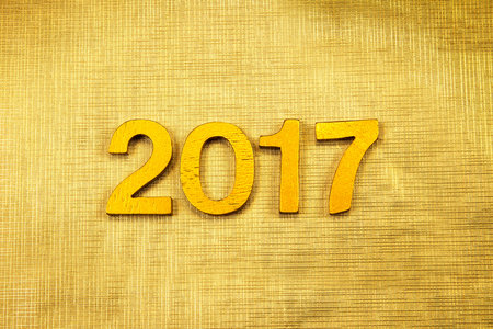 Number 2017 placed on gold elegant glamour background for new year 2017 celebration concept