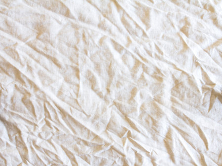the crumpled white fabric texture surface background