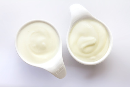 Close up natural creamy white yogurt in cupの写真素材