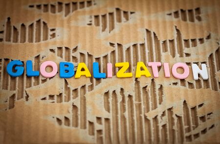 globalization wording on abstract torn cardboard backgroundの写真素材