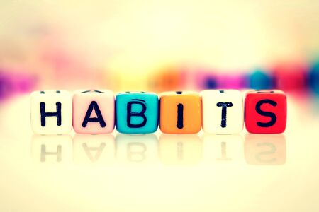 colorful word cube of habits on white background , vintage color toneの写真素材