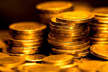 Close up gold money coin stacking on dark background