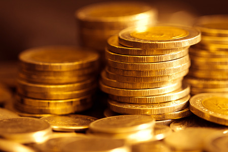 Close up gold money coin stacking on dark backgroundの写真素材