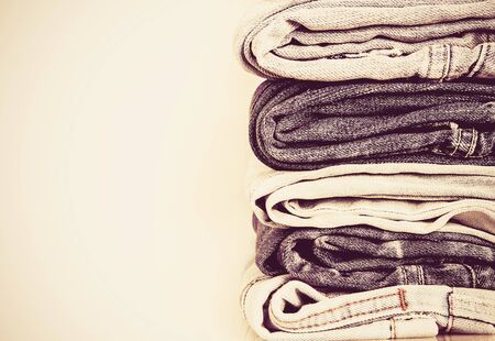 stacking of the different blue jeans , vintage color toneの写真素材