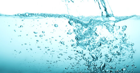 the Close up blue Water splash with bubbles on white background