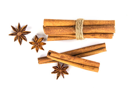 Close up brown cinnamon stick with star anise spice isolated on white background , overhead and top viewの写真素材