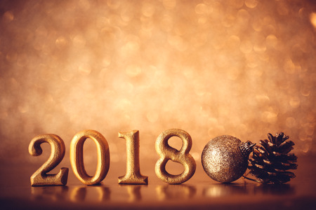 The Golden Number 2018 placed on dark elegant glamour night tone background for new year 2018 celebration conceptの写真素材