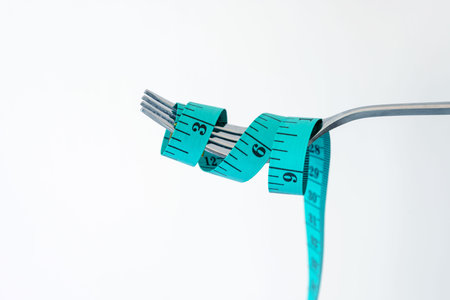 Diet for weight loss , measuring tape with fork for take care healthy eating concept