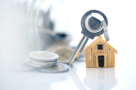 Close up house model place on stacking of money coin for home mortgage and loan ,  refinance or...