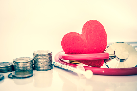 Health  insurance and Medical Healthcare heart disease concept , red heart shape with stethoscope , financail healthcareの写真素材