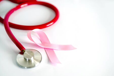 Breast Cancer Health  insurance  for Medical Healthcare disease insurance concept,  stethoscope and pink ribbon on white backgroundの写真素材