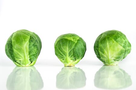 Fresh green brussel sprouts vegetable on white backgroundの写真素材