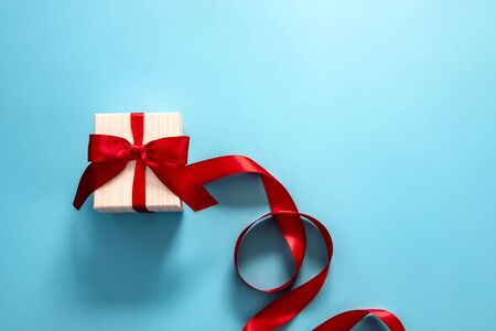 gift box with red bow on blue background . Happy Father's or Mother's or Women 's  day celebration conceptの写真素材