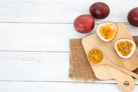 Close up fresh passion fruit on white wooden table backgroundの写真素材