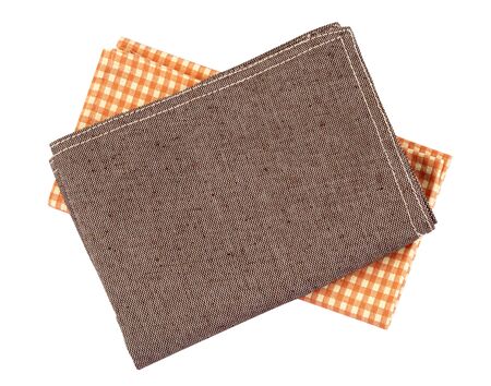 crumpled orange brown checkered napkin table clothes  on white background.の写真素材