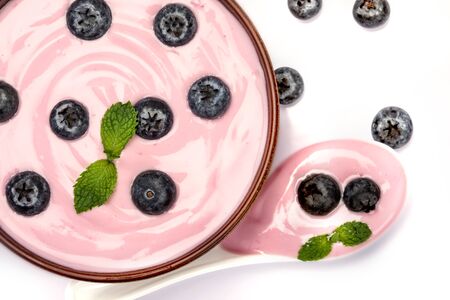 Top view of blueberry yogurt on white backgroundの写真素材