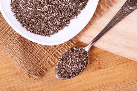 Close up a Chia seeds in  spoon , superfood and rich of nutrient an antioxidantの写真素材
