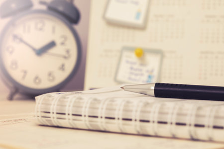 Close up pen on business agenda book , business planning and schedule list deadline reminder conceptの写真素材