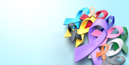 multi colorful cancer awareness ribbon on blue background design for campaign of World Cancer Day banner and background, 3d renderingの写真素材