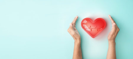 Hand hold 3d transparent heart shape with cardiogram, heart disease awareness campaign, cardiovascular health, Stroke Prevention, hypertension (high blood pressure) for heart disease conceptの写真素材
