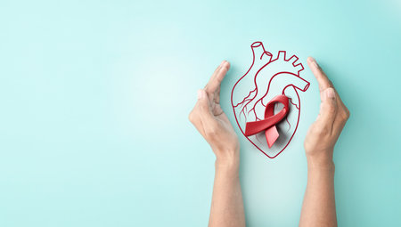 Hand hold 3d red ribbon and line heart organ and cardiogram, heart disease awareness campaign, cardiovascular health, Stroke Prevention, hypertension (high blood pressure) for heart disease conceptの写真素材