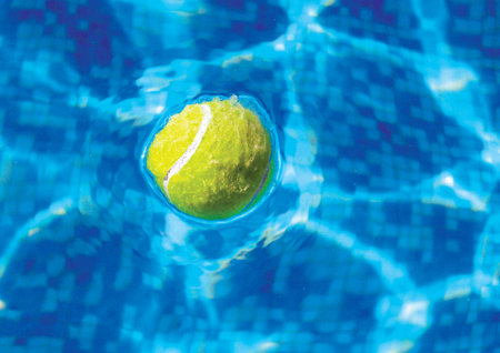 Tennis ball floating in water