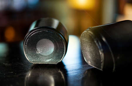 small speaker boxes on black table with lights on background. soft and selective focusの写真素材
