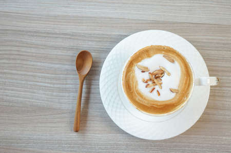 top view a cup of hot coffee on wood backgroundの写真素材