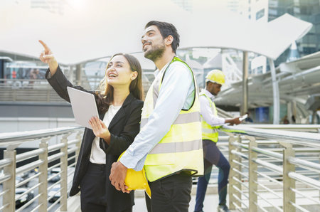 woman project manager working with tablet pointing index finger at something to work with coworker...