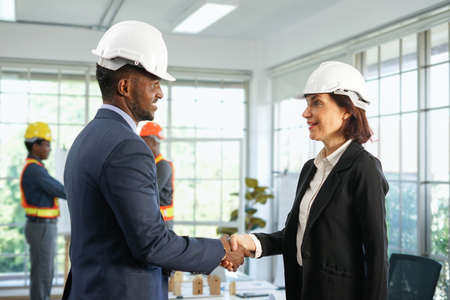 woman business engineer shaking hand with partnership for business cooperation in the meeting room, selective focusの写真素材