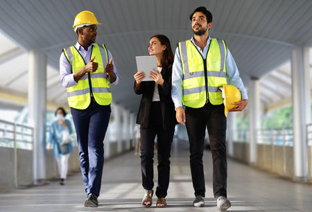 business engineers or architects colleagues working outdoor, business woman project manager with...