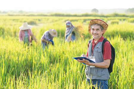 portrait agronomist or researcher writing paperwork on clipboard while interview a farmer for...
