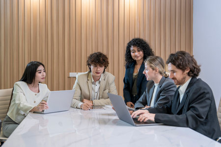 group of multiracial business colleagues meeting in the office,discussing on table in a conference room.,collaborating happy business peopleの写真素材